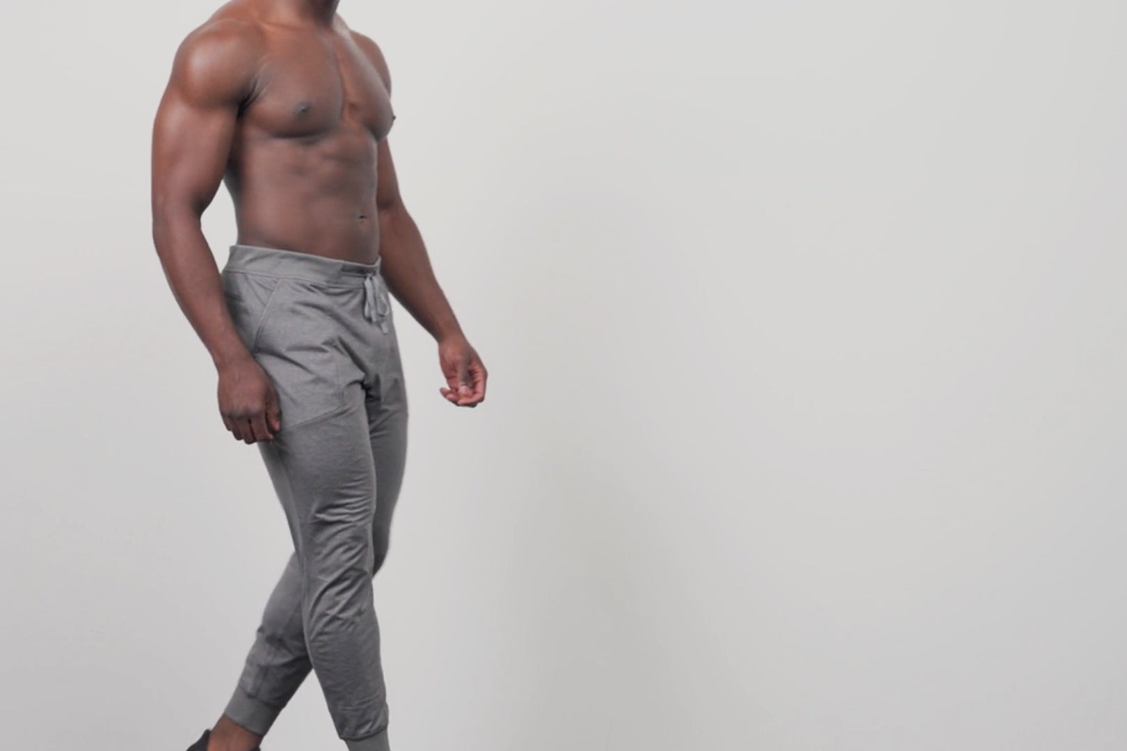A video of an athlete doing a standing quad stretch in Men's Apollo Joggers