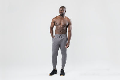 A video of an athlete walking into the shot wearing the grey Men's Apollo Joggers in Heather Cool Gray, Heather Black, Heather Navy