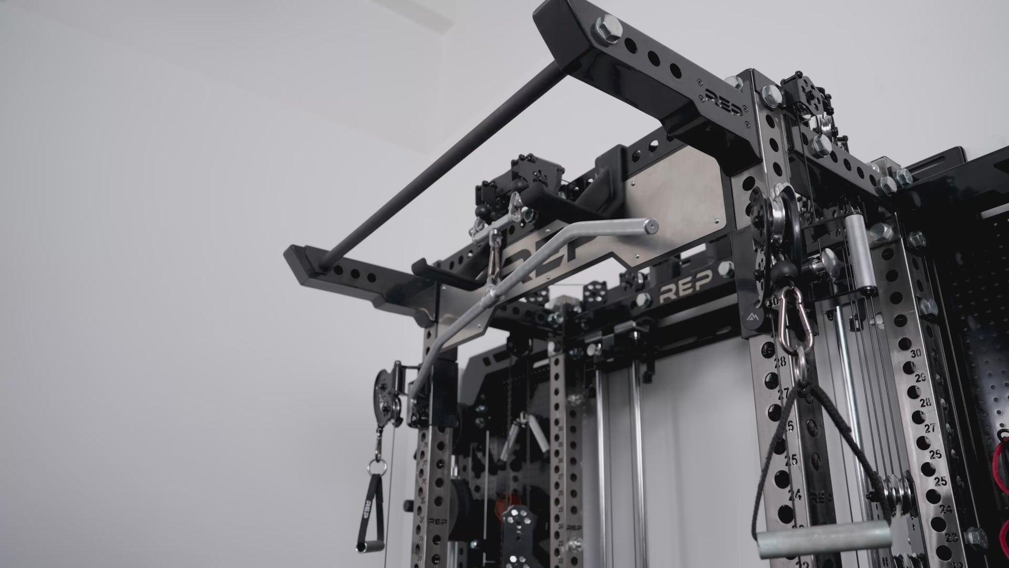 Wall-Mounted Ares™ 2.0 close-up video highlighting the pull-up bar brackets and lat pulldown