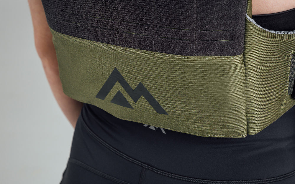 Mountain logo on the back bottom of the Strata Weight Vest