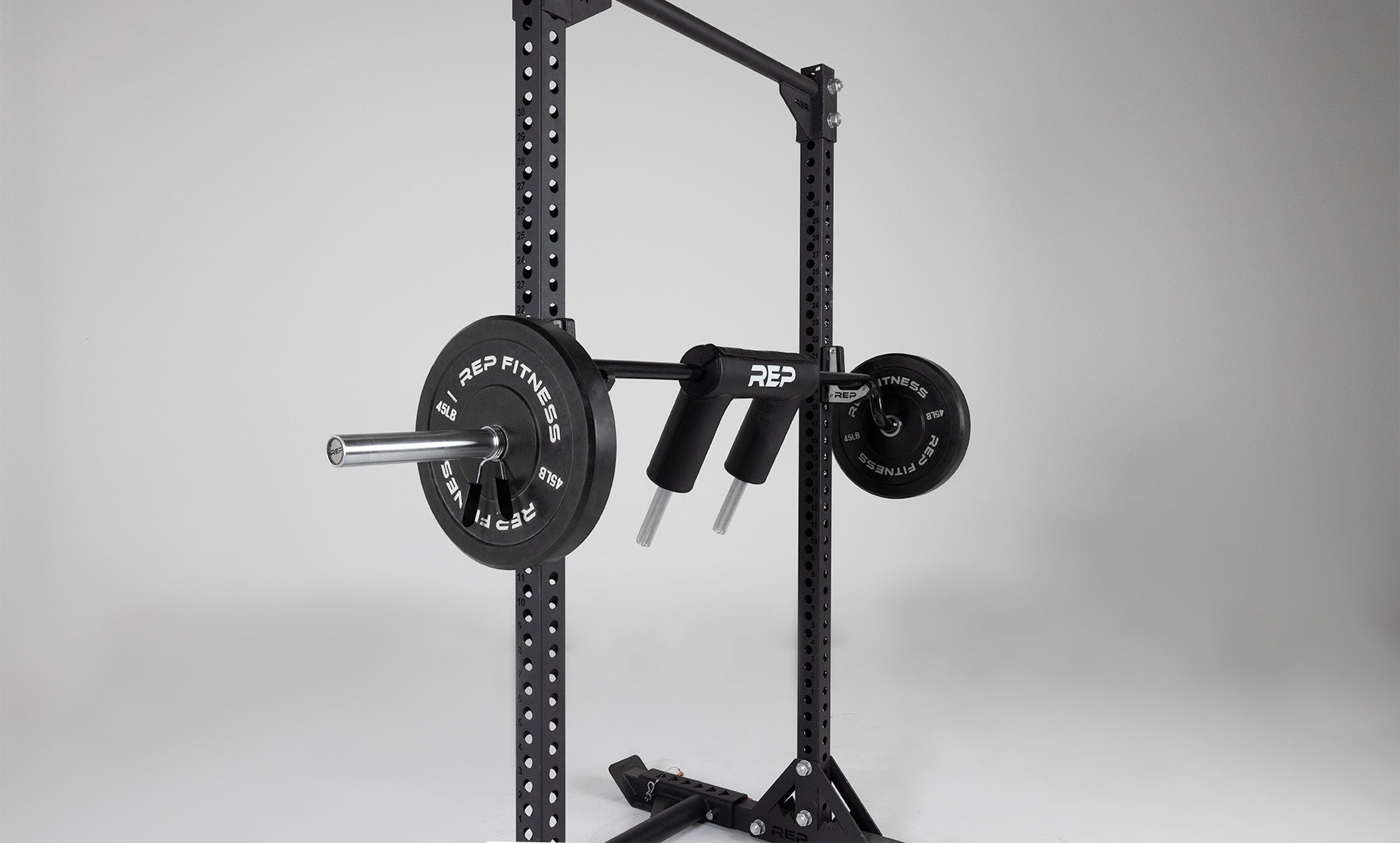 Loaded Safety Squat Bar racked on j-cups on a REP Yoke.