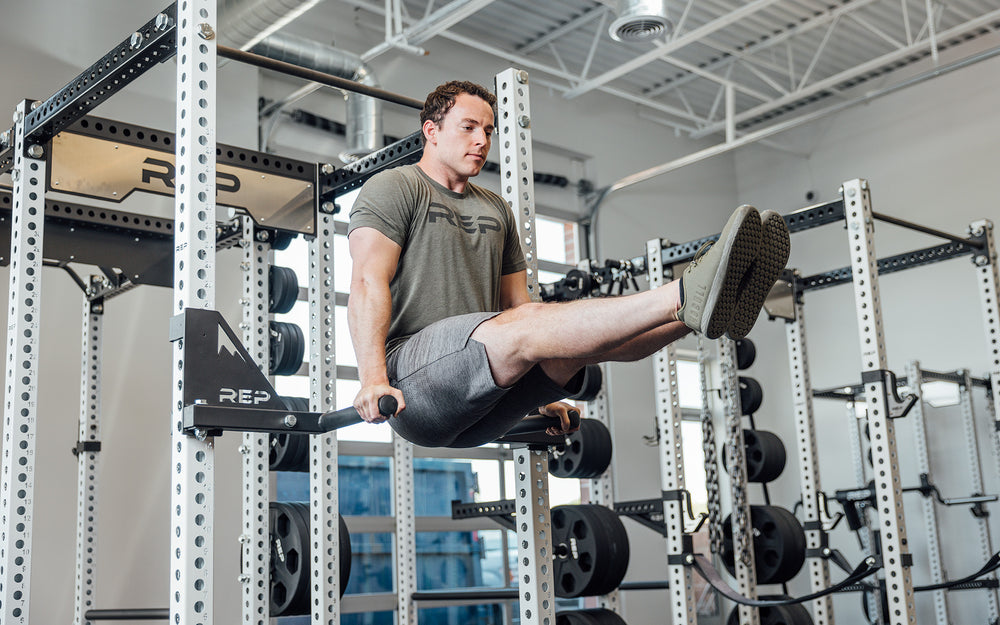 Drop-In Dip Attachment on PR-5000 Power Rack Being Use for L-Sit Hold