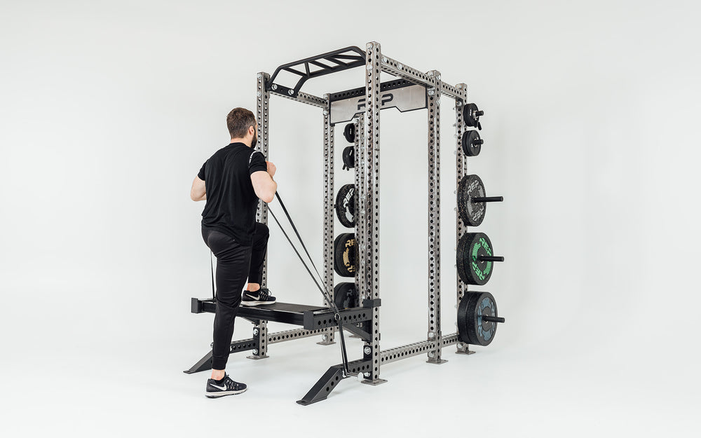 Utility Seat Installed on Spotter Arms on Power Rack Being Used For Resistance Band Step-Ups