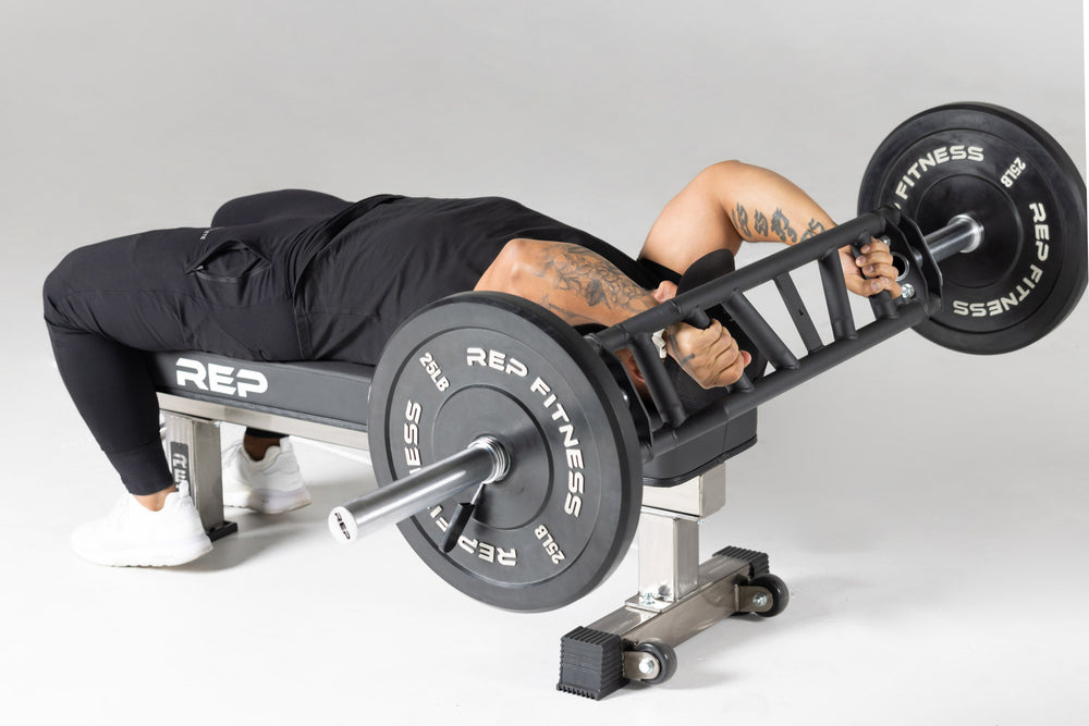 Lifter using loaded Cambered Swiss Bar for skull crushers.