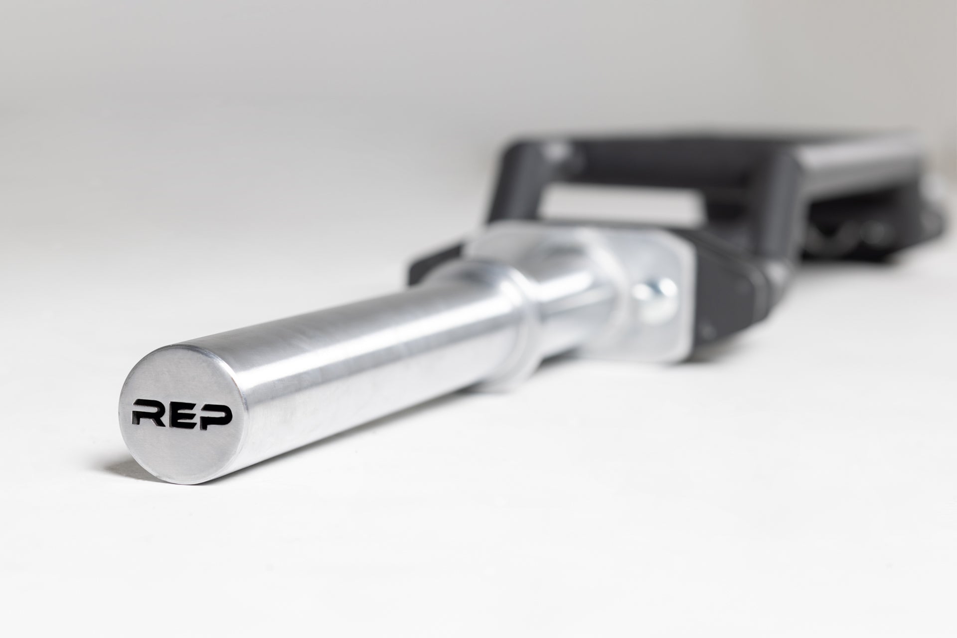 Cambered Swiss Bar premium chrome sleeve with REP logo.