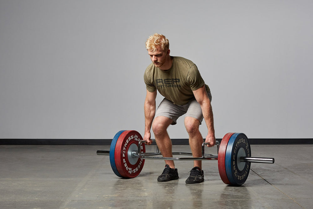 Lifter set-up and preparing to perform a deadlift with a loaded Trap Bar.