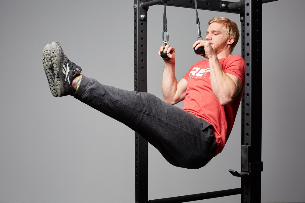 Cannonball Grips Attached To Power Rack For Grip Strength Exercises