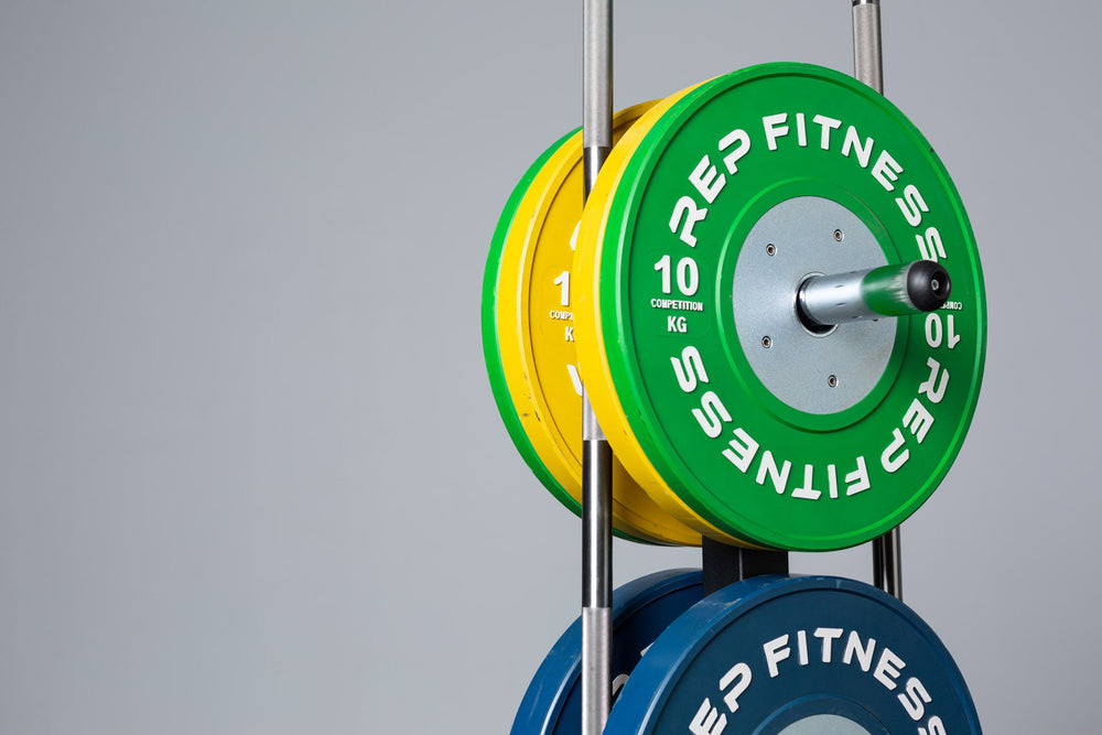 Close-up view of the top section of the REP Bar and Weight Plate Tree loaded with a pair of 10kg REP Competition Bumper Plates and two barbells.