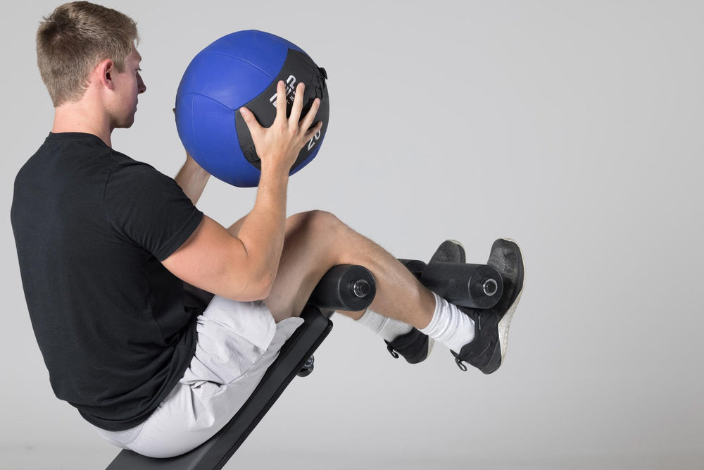 Decline sit-ups with a medicine ball