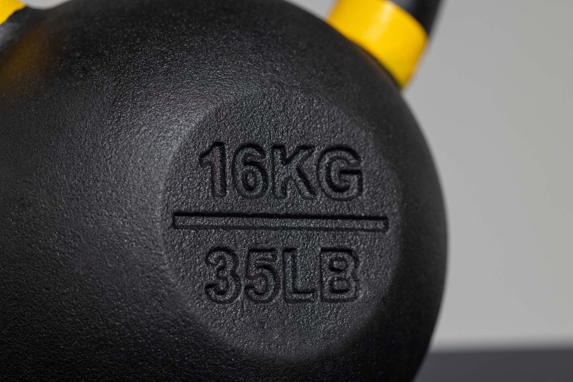 KB and LB markings on kettlebell