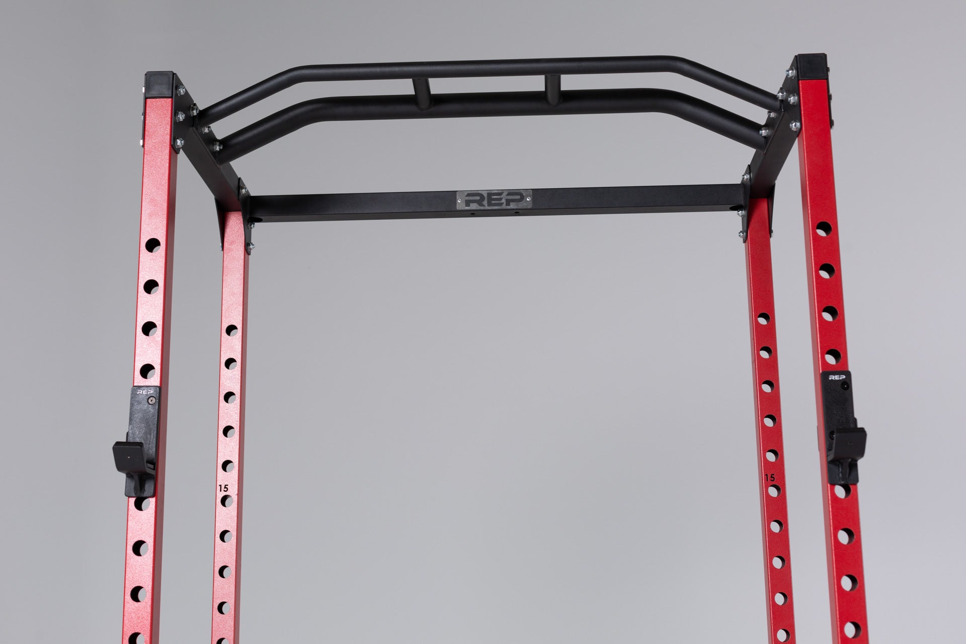 PR-1100 Power Rack Red Close Up With  Standard J-Cups on Uprights and the Multi-Grip Pull-Up Bar