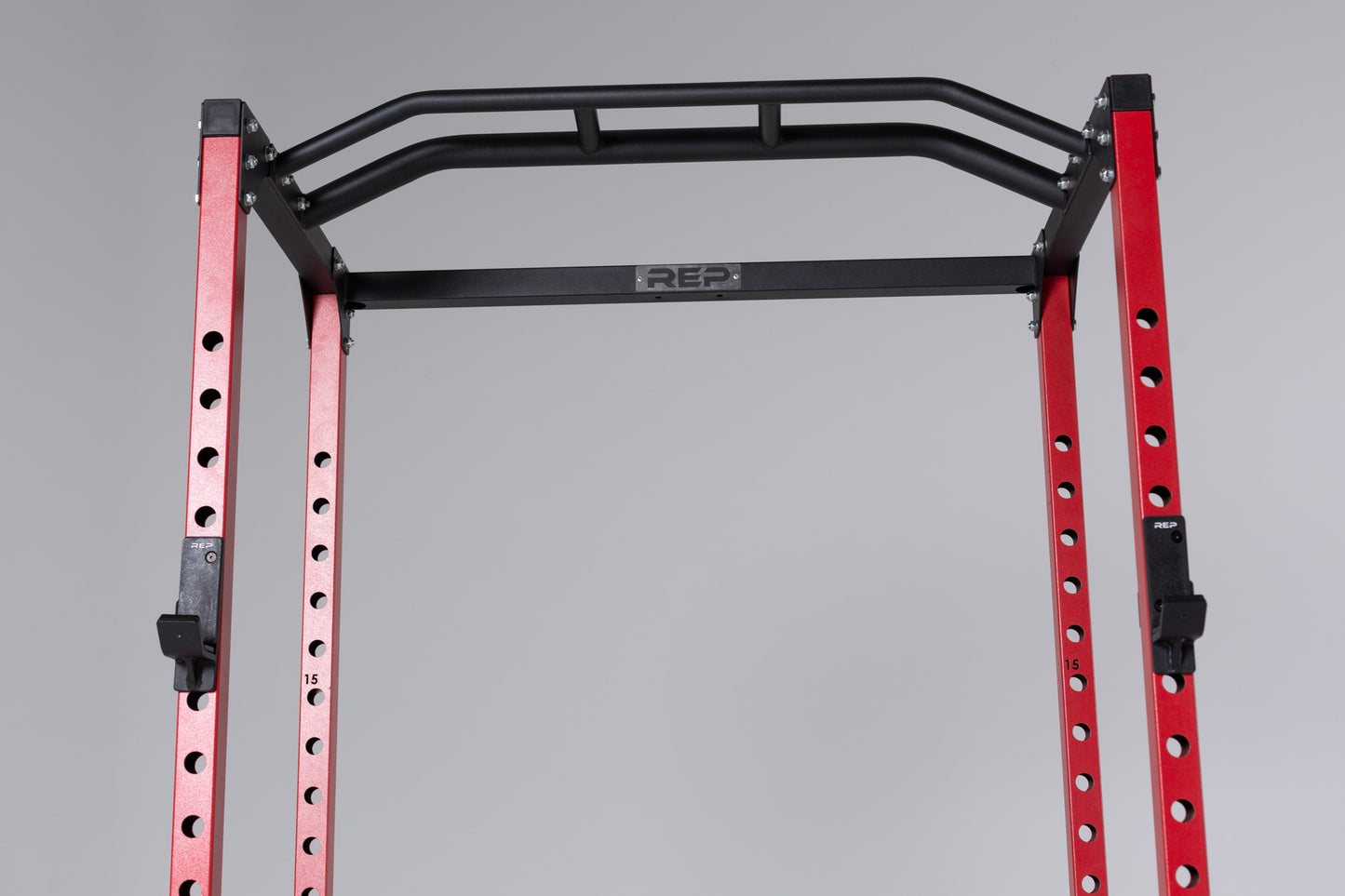 PR-1100 Power Rack Red Close Up With  Standard J-Cups on Uprights and the Multi-Grip Pull-Up Bar