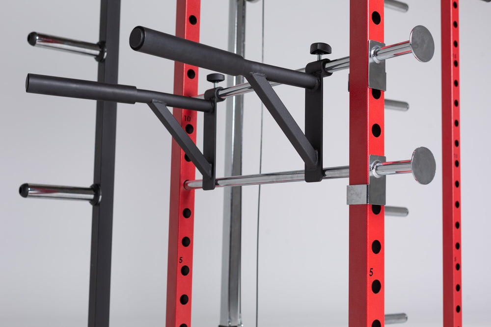 PR-1100 Power Rack in Red. Close Up of Dip Station Installed on Pin-Pipe Safeties.