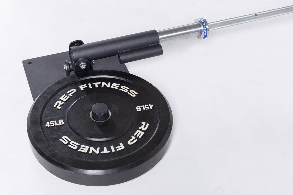 REP Free Standing Landmine with a barbell in the sleeve and a 45lb REP bumper plate on the weight horn to keep the landmine in place.