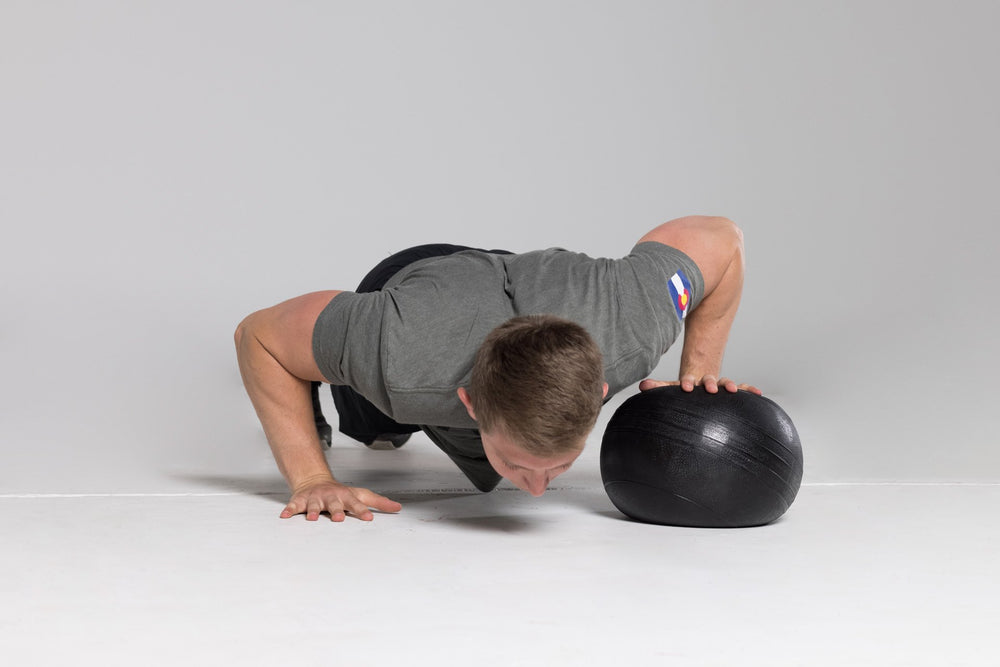 Push-ups with 1 hand on a Slam Ball