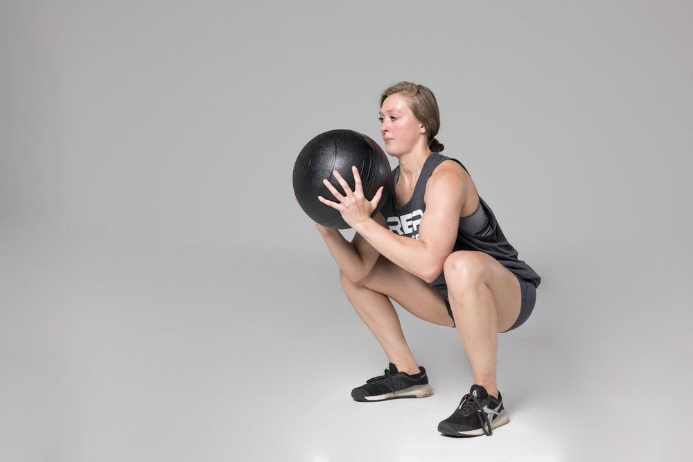 Squatting with a Slam Ball