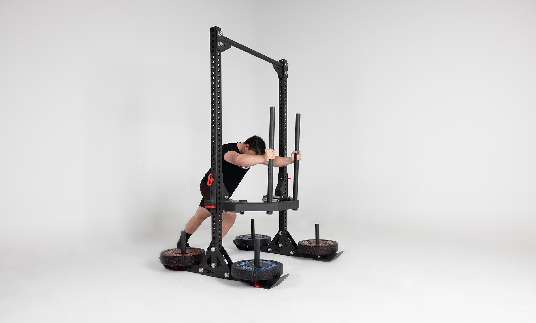 Oxylus Yoke With Carry Attachment and Pull-Up Bar Being Used for Sled Push