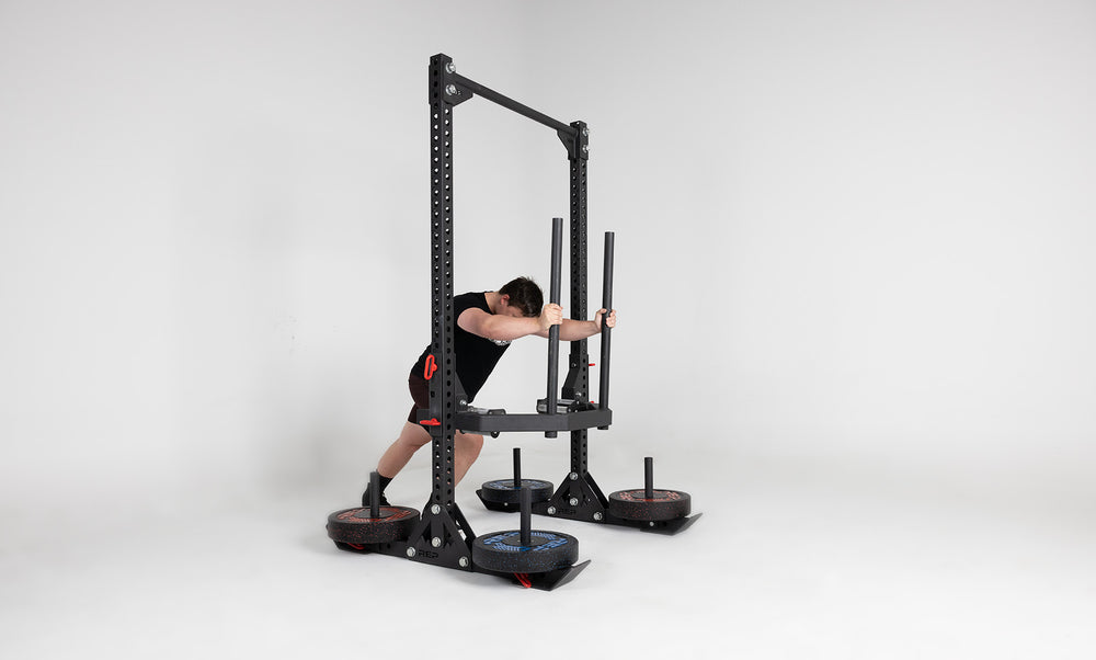 Oxylus Yoke With Carry Attachment and Pull-Up Bar Being Used for Sled Push