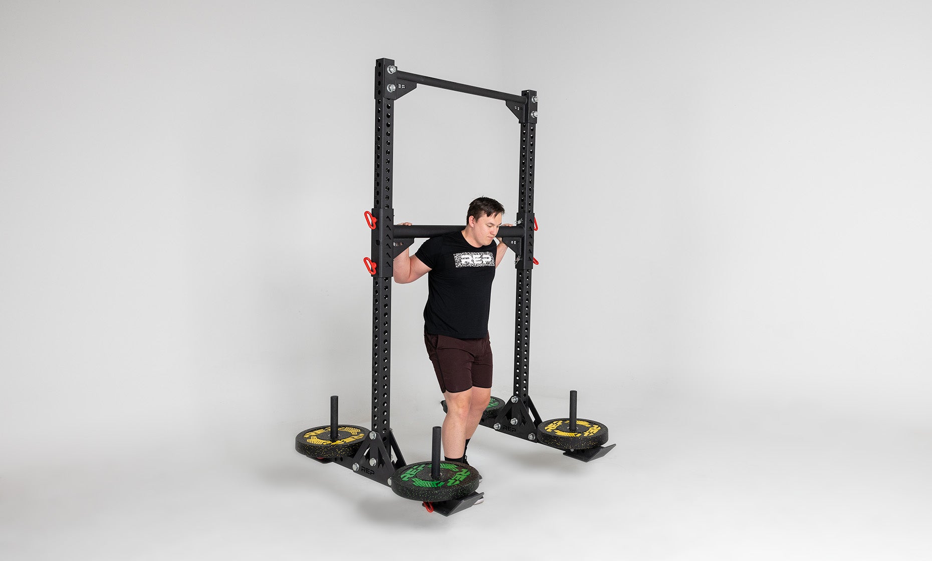 Oxylus Yoke With Pull-Up Bar Being Used For Heavy a Carry With Weight On All Four Weight Horns